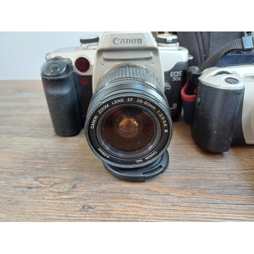 563 - Three Canon EOS 35mm SLR cameras, one 650 fitted with Sigma 28-200mm 1:3.8-5.6 zoom lens, one cased ... 