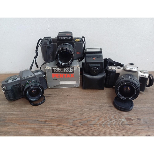 565 - Three Pentax 35mm SLR cameras, one SFXN autofocus fitted with Pentax-M 135mm 1:3.5 lens, one MZ-10 f... 