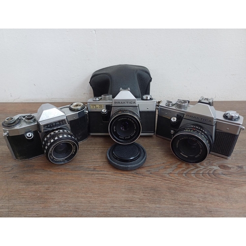 567 - Three Praktica 35mm SLR cameras, one cased TL3 fitted with Carl Zeiss Tessar 2.8/50 lens, one MTL3 f... 