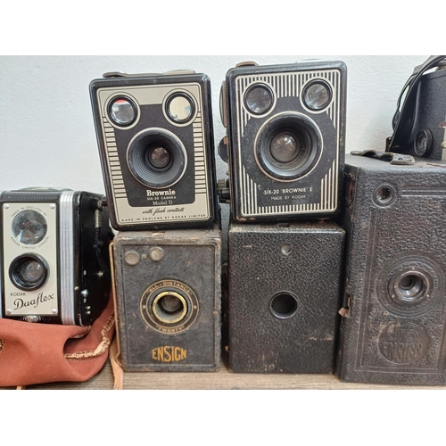 568 - A collection of box cameras to include cased Kodak Duaflex pseudo TLR, Houghton-Butcher J-B Ensign, ... 