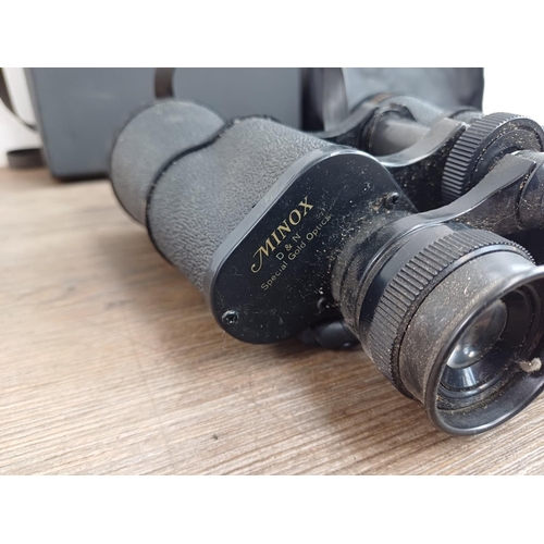 570 - Two cased pairs of binoculars, one Traveler 10-30x60 zoom and one Minox D & N 16x50