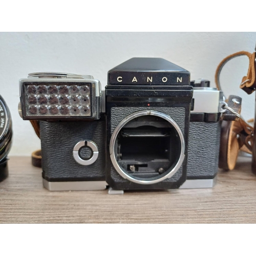 575 - A Canon Canonflex R2000 35mm SLR camera body with clip-on articulated selenium meter and two Super-C... 