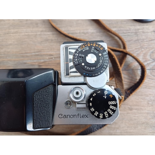 575 - A Canon Canonflex R2000 35mm SLR camera body with clip-on articulated selenium meter and two Super-C... 