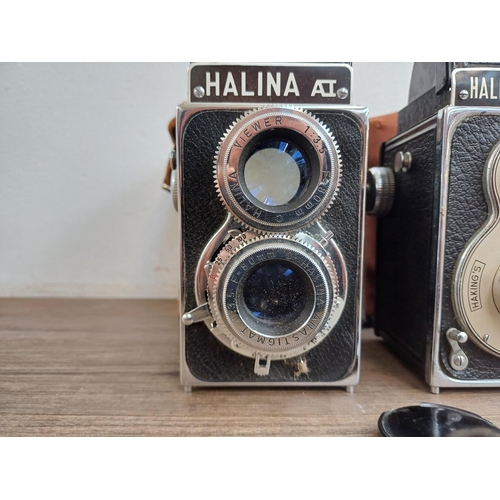 577 - Two cased Haking Halina 6x6 medium format cameras for 120 film, one A1 TLR and one Prefect pseudo TL... 