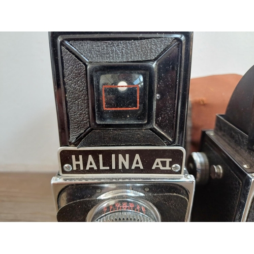 577 - Two cased Haking Halina 6x6 medium format cameras for 120 film, one A1 TLR and one Prefect pseudo TL... 