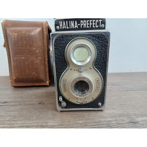 577 - Two cased Haking Halina 6x6 medium format cameras for 120 film, one A1 TLR and one Prefect pseudo TL... 