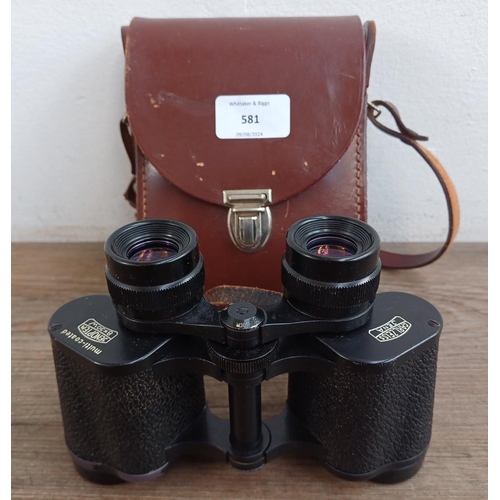 581 - A cased pair of vintage Carl Zeiss Jenoptem 8x30W binoculars