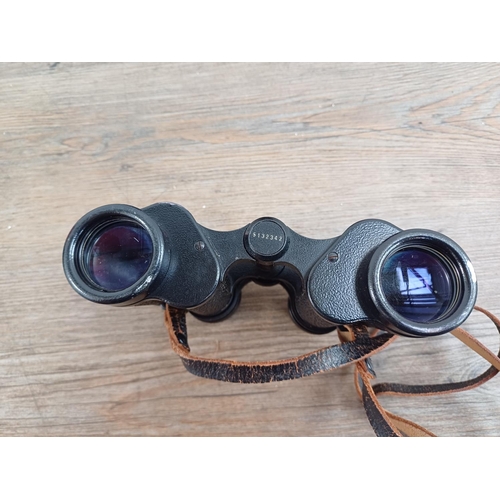 581 - A cased pair of vintage Carl Zeiss Jenoptem 8x30W binoculars