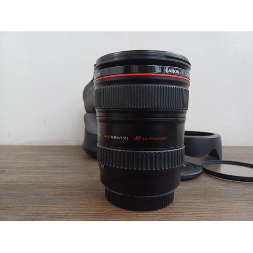 582 - A cased Canon Ultrasonic (red) L-series EF 24-105mm 1:4 L IS USM macro lens for Canon AF