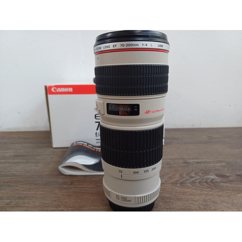 585 - A boxed Canon Ultrasonic (red) L-series EF 70-200mm 1:4 USM zoom lens for Canon AF with ET-74 lens h... 