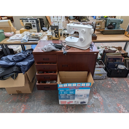 753 - Two items, one boxed Singer M2405 electric sewing machine with foot pedal and instruction manual and... 