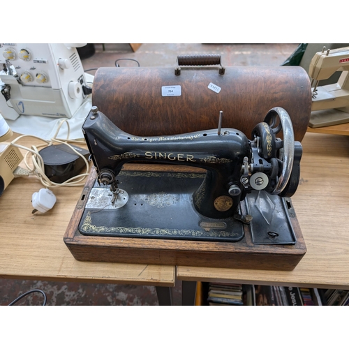 754 - A cased 1935 Singer 99K hand crank sewing machine