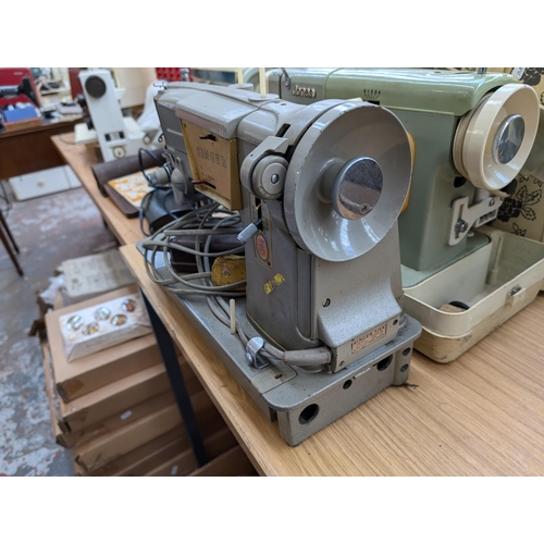 763 - Two cased vintage electric sewing machines with foot pedals, one Singer 328K and one Jones 222