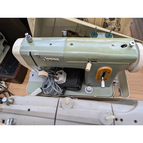 763 - Two cased vintage electric sewing machines with foot pedals, one Singer 328K and one Jones 222