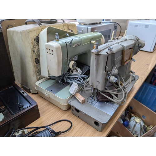 763 - Two cased vintage electric sewing machines with foot pedals, one Singer 328K and one Jones 222