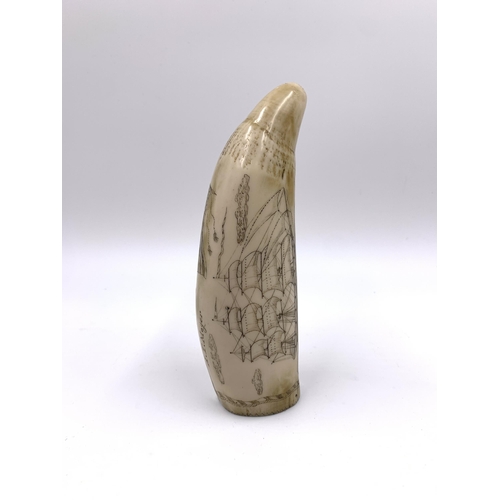 2150 - A reproduction resin scrimshaw whale tooth, engraved A. T. Moger - approx. 16cm