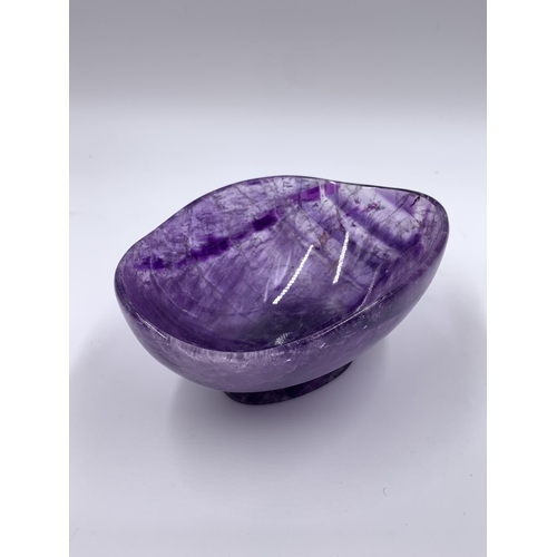 2151 - A carved amethyst pedestal bowl, signed to base - approx. 7cm high x 10cm wide x 15cm long