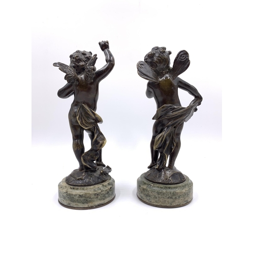 2157 - A pair of bronze cherub sculptures on circular mottled marble plinths, after Auguste Moreau - approx... 