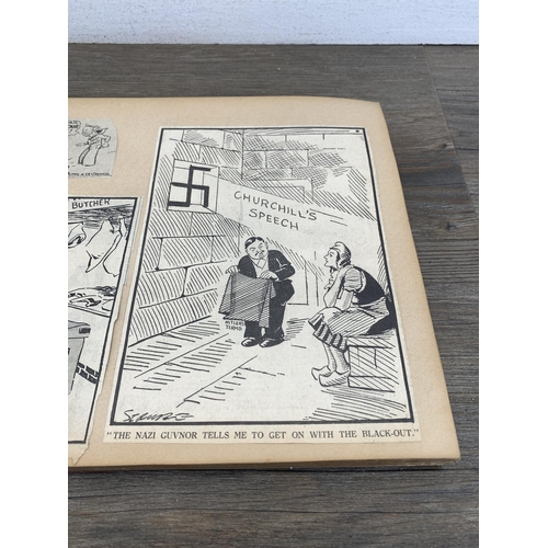 2166 - A WWII scrapbook containing a large collection of British comical newspaper clippings