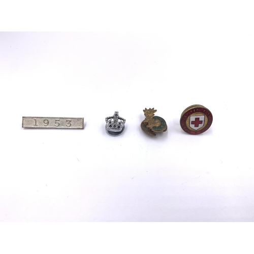 2167 - A collection of medals and badges to include WWI British medal pair presented to 35983 Pte. A. Mouls... 