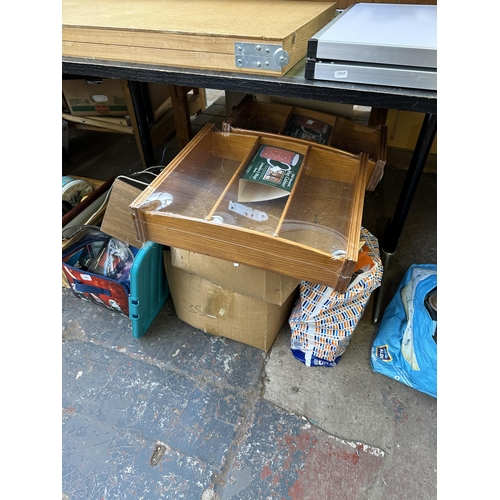 1097 - A collection of house clearance items to include boxes AEG cooker extraction hood, motorcycle paddoc... 