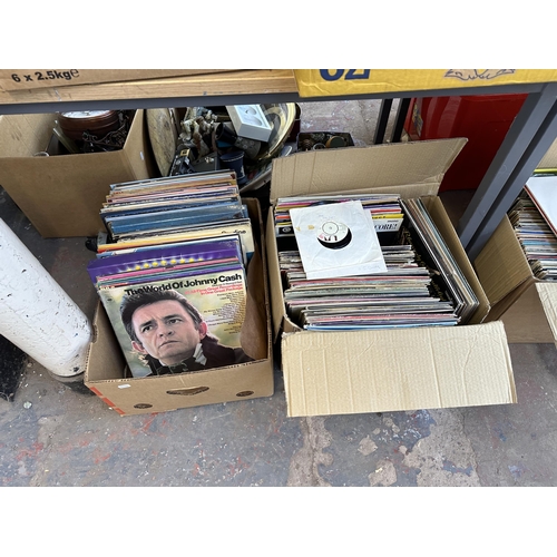 1102 - Eight boxes containing a large collection of LP vinyl records to include Johnny Cash, The Everly Bro... 