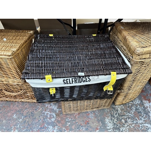 1108 - Fifteen wicker items to include linen basket, child's chair, storage chests etc.