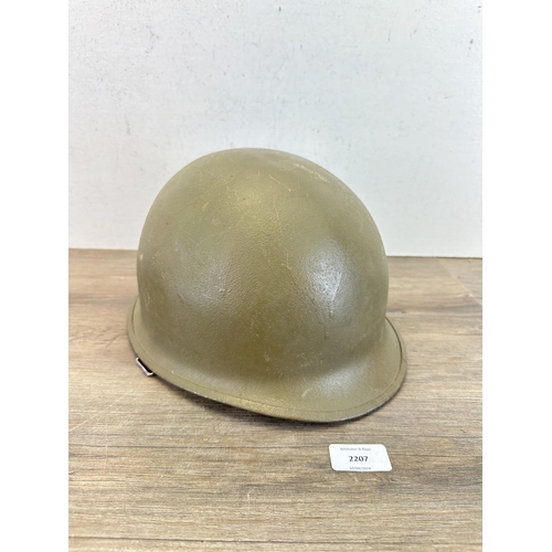 2207 - A US M1 helmet with liner