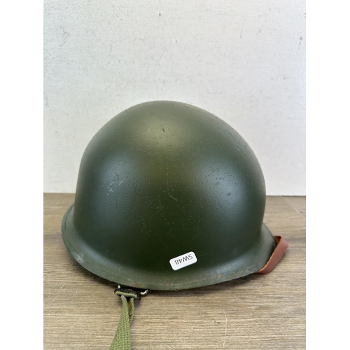 2209 - A WWII US M1 helmet with liner