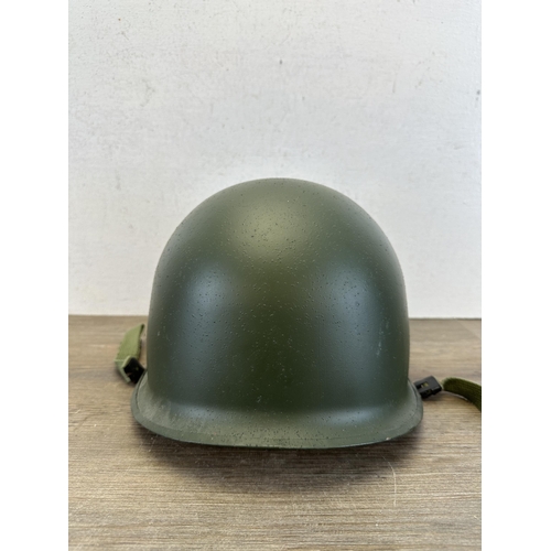 2209 - A WWII US M1 helmet with liner