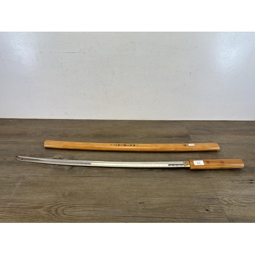 2211 - A reproduction Japanese stainless steel sword with wooden scabbard - approx. 100cm including scabbar... 