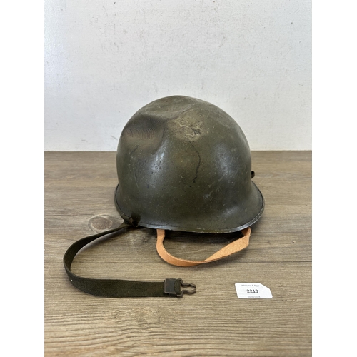 2213 - A WWII US M1 helmet with liner with Belgian M51 liner