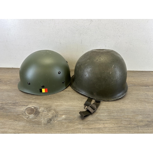 2213 - A WWII US M1 helmet with liner with Belgian M51 liner