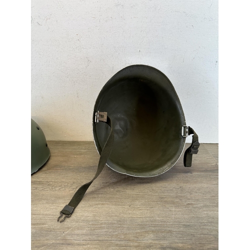 2213 - A WWII US M1 helmet with liner with Belgian M51 liner