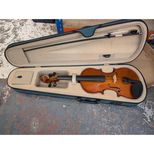 649 - Three items, one cased Antoni ACV30 'Debut' full-size student violin with bow, rosin and boxed Rotos... 