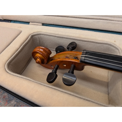 649 - Three items, one cased Antoni ACV30 'Debut' full-size student violin with bow, rosin and boxed Rotos... 