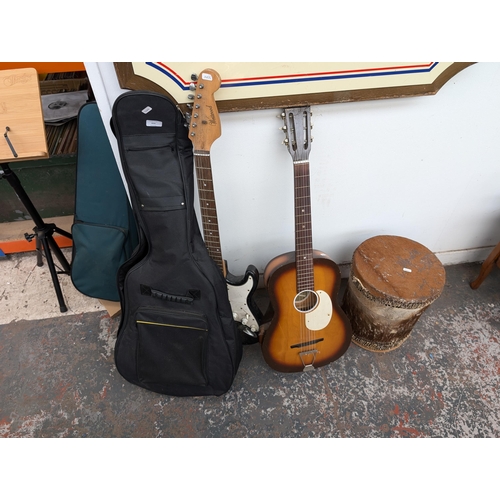 650 - Four musical instruments, one cased Music Alley child's nylon strung guitar, one Westwood stratocast... 