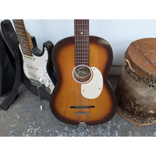 650 - Four musical instruments, one cased Music Alley child's nylon strung guitar, one Westwood stratocast... 