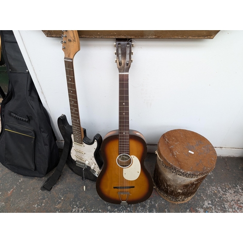 650 - Four musical instruments, one cased Music Alley child's nylon strung guitar, one Westwood stratocast... 