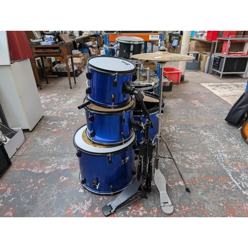 653 - A collection of drum kits items to include Mapex bass drum pedal, snare with remo head, Zildjian ZBT... 