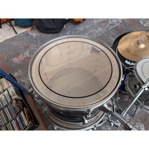 653 - A collection of drum kits items to include Mapex bass drum pedal, snare with remo head, Zildjian ZBT... 