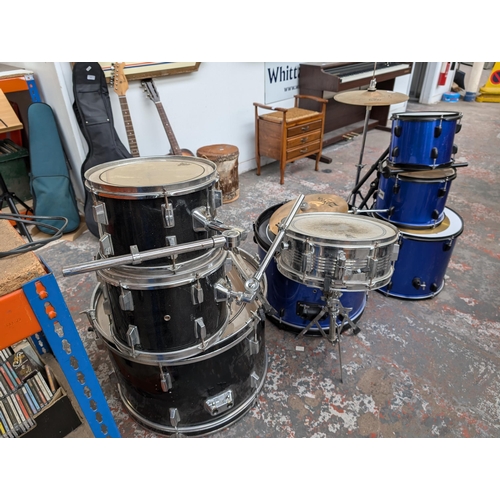 653 - A collection of drum kits items to include Mapex bass drum pedal, snare with remo head, Zildjian ZBT... 