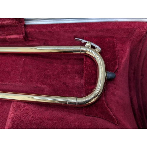 661 - A cased Besson 600 trombone with Besson 7 mouthpiece