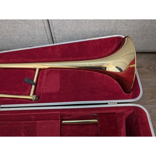 661 - A cased Besson 600 trombone with Besson 7 mouthpiece