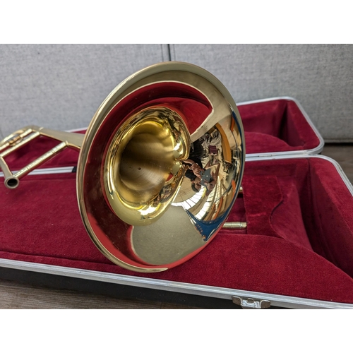 661 - A cased Besson 600 trombone with Besson 7 mouthpiece