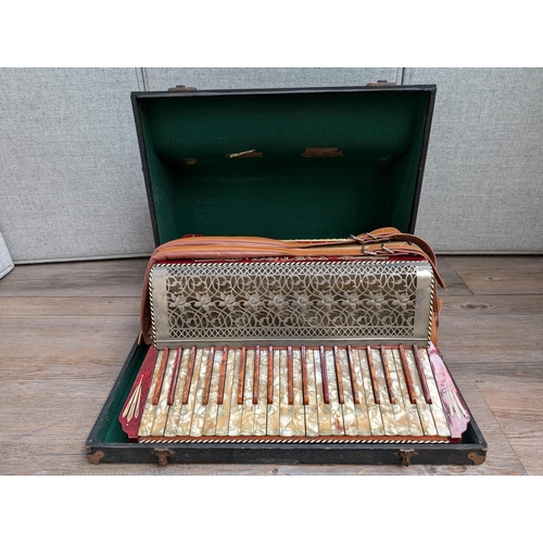 662 - A cased vintage German Pietro 120 bass piano accordion