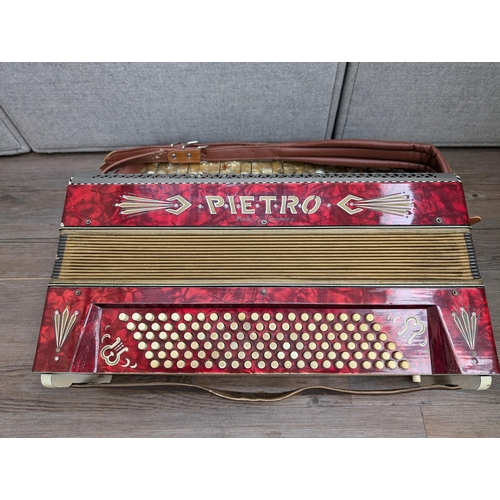 662 - A cased vintage German Pietro 120 bass piano accordion