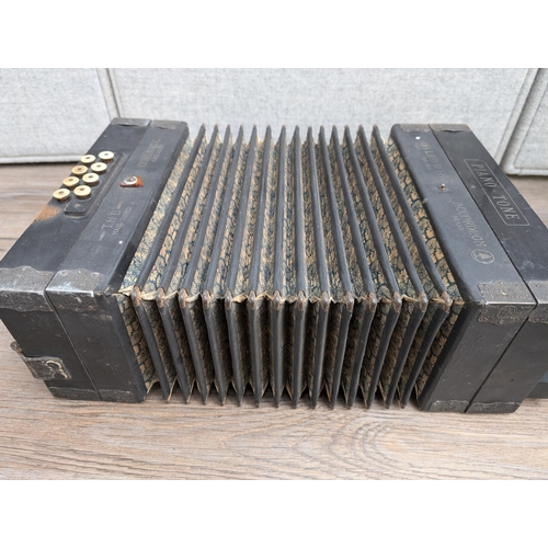 663 - An early 20th century German Gebrüder Ludwig Piano-Tone eight bass piano accordion