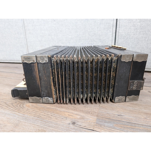 663 - An early 20th century German Gebrüder Ludwig Piano-Tone eight bass piano accordion