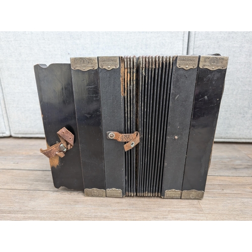 663 - An early 20th century German Gebrüder Ludwig Piano-Tone eight bass piano accordion